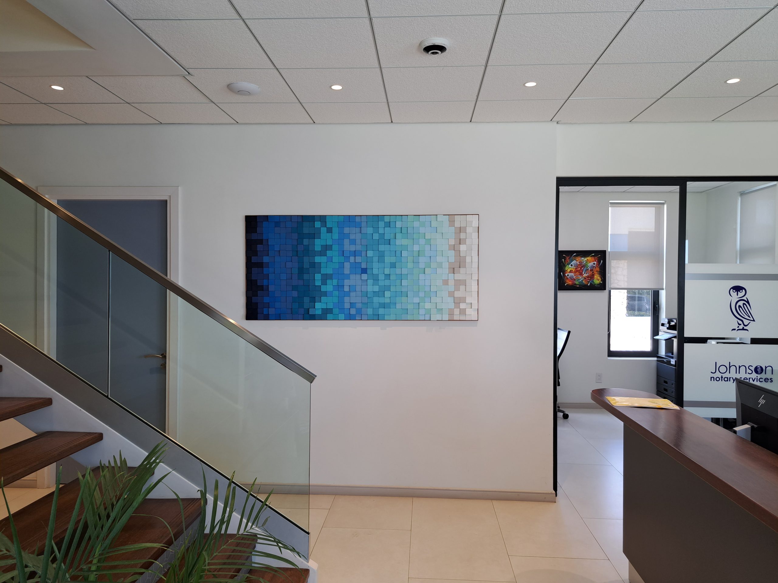 Horizontal blue and white modular relief at Notary Johnson.